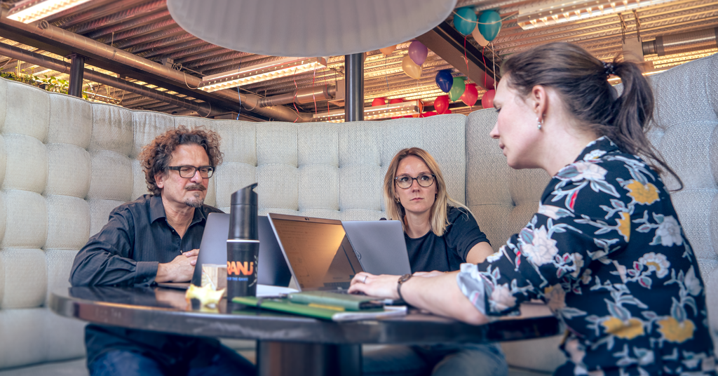 People discussing a project in a professional setting